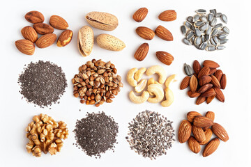 Obraz premium An assortment of nuts and seeds spread out on a white background