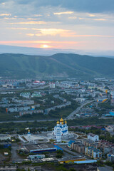 Beautiful aerial city landscape. Morning cityscape. Top view of the cathedral, buildings and streets. Sunrise. Holy Trinity Cathedral, City of Petropavlovsk-Kamchatsky, Kamchatka, Far East of Russia.