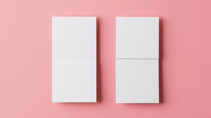 Fototapeta premium Two vertical blank business cards on pink background for contact and communication concept