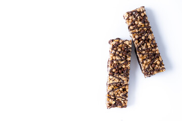 Healthy Muesli bars with nuts and black chocolate isolated on white background.Top view. Copy space