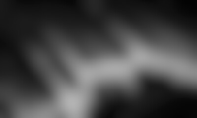Abstract blurred background image of black, gray colors gradient used as an illustration. Designing posters or advertisements.