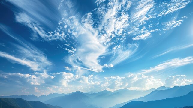 Scenic sky with clouds above mountains