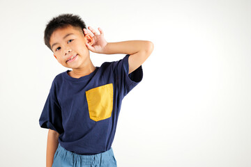 Portrait Asian young child smiling overhearing listening sound to gossip with attention with hand...
