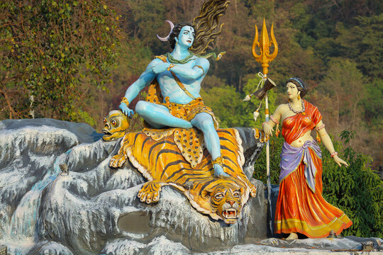 Sculpture "God Shiva and Parvati" on the banks of the Ganges in Rishikesh, India, April 7, 2024