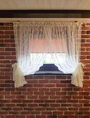 Short window sill tulle in the interior