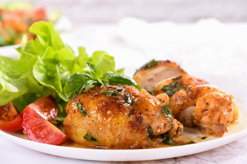 Chicken thigh with gravy and vegetable side dish