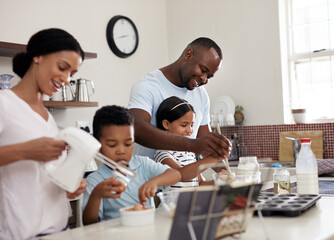 Baking, happy family and children in kitchen for recipe, development and making cupcakes for mothers day. Mom, dad and kids at home for teaching, bonding and siblings for teamwork and growth together