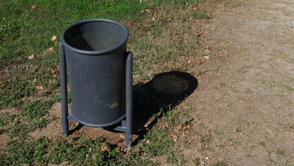 Urban furniture in parks. Garbage bin.