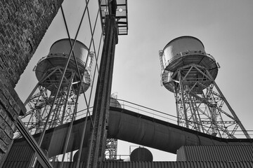 reflection of industrial building in black and white