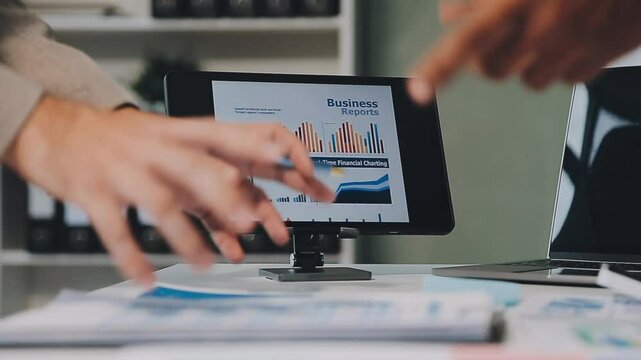 Business meeting time,business account managers crew working with new startup project,report analysis cost graph on desk at meeting room.