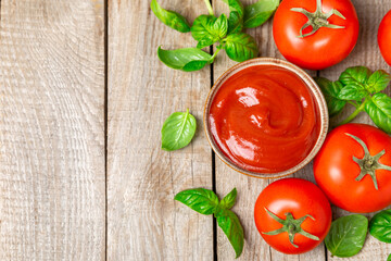 Fresh cherry tomatoes and fresh green basil on a textured background. Tomato sauce. Vegan. Ingredients for salad. Organic food. Place for text. Copy space.