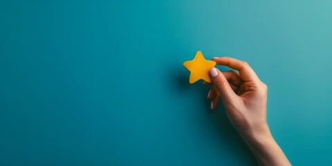 Fototapeta premium Woman's Hand Holding a Star on Blue Background. Concept of Customer Experience. Service Level. Customer Satisfaction Evaluation. Customer Service, Generative Artificial Intelligence