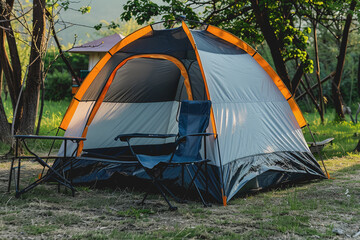 Camp in the sunny outdoors with just one tent. camping chair BBQ rack During the day.