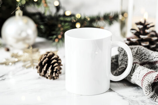 White Mug Mockup on Marble Surface With Winter Decor