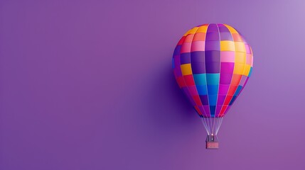 Fototapeta premium A colorful hot air balloon against a purple background, offering room for copy text.