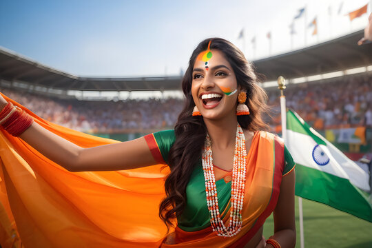 Happy Indian woman supporter with face painted in India flag colors, green white and orange, female fan at a sports event such as cricket or field hockey match, blurry stadium background, copy space 
 - Powered by Adobe