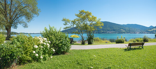 recreational area Bad Wiessee with benches, view to lake Tegernsee, bavaria