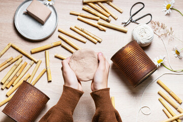 Step 2. Form a round, flat layer of air dry clay with your hand. Create a DIY bug hotel for garden....