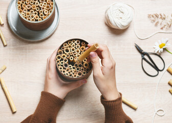Step 5. Continue filling the can with bamboo until it is full, and the sticks are tightly packed...