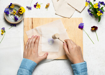 Step 3. Take a hammer and begin to pound the flower. Hammered flower prints on fabric. Easy nature...