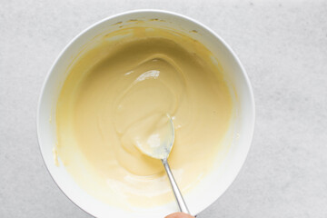 Overhead view of nigerian akamu or pap paste, process of making akamu, flatlay of process of making nigerian akamu ogi pap or corn pudding