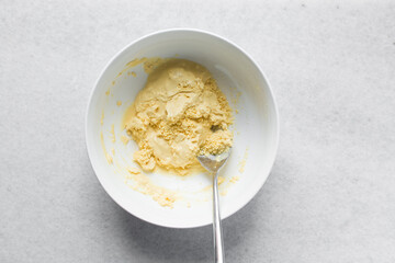 Overhead view of nigerian akamu or pap paste, process of making akamu, flatlay of process of making nigerian akamu ogi pap or corn pudding