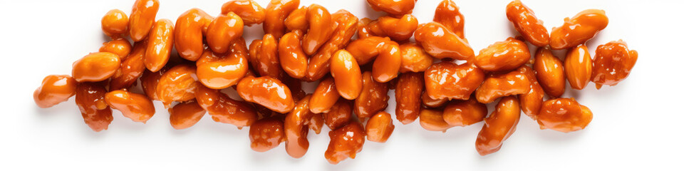 Peanuts covered in a shiny caramel coating arranged in a line on a white background.
