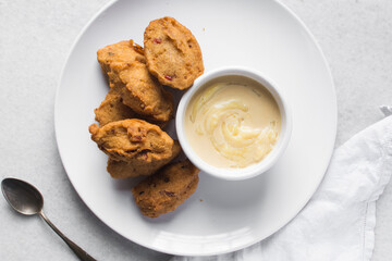 Overhead view of akara and nigerian akamu or pap, flatlay of nigerian akara fried bean cake and akamu ogi pap or corn pudding