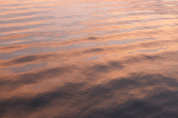 The water is calm and still, with a beautiful orange