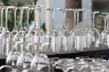 A row of glasses are lined up on a table