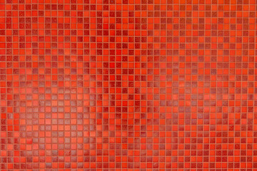 A red tile wall with a red background