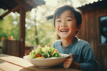 Salad eating smile child.
