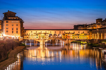 Fototapeta premium Ponte Vecchio bridge and Arno river waterfront in Florence evening view