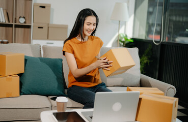 Small business entrepreneur SME freelance woman working at home office, BOX,tablet and laptop online, marketing, packaging, delivery