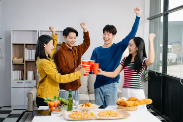 Group of Young Asian friend having, enjoy evening party together at home. Attractive young man and...