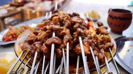 Juicy Marinated Meat Skewers and Grilling on Charcoal BBQ - Perfect Outdoor Cooking