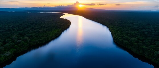 Fototapeta premium Sunset Over a Winding River in the Jungle.