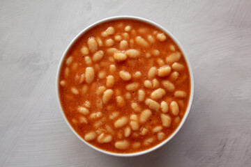 Bowl of Canned White Beans with Tomato Sauce, top view. Copy space.