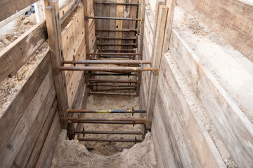 repairing underground utilities, essential infrastructure, protecting electrical wires in trench, repairing urban communications, conducting electrical networks