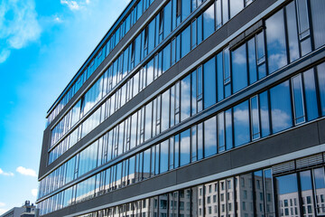 Multi-story modern glass buildings, residential and office, Vertical living meets corporate ambition, Concrete jungle, business district