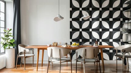 A modern dining room with a geometric patterned wall and a wooden dining table. The room features a window with curtains, a potted plant, and two pendant lights.