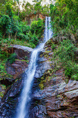 Waterfall in a remote and preserved location within the tropical forest in the state of Minas Gerais, Brazil