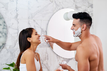 Couple, apply shaving foam and nose in bathroom, cosmetics and product for hair removal. Married people, profile and treatment for hygiene or grooming in home, cream and cleaning play in routine