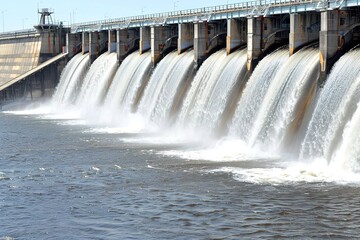 A large water dam that forms a waterfall