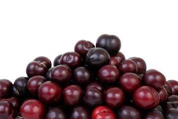 Many cherry plums isolated on white, copy space for text.