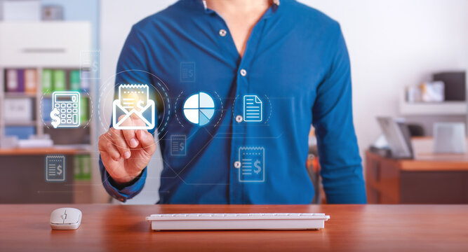 Invoicing and Financial Management. Businessman using digital tools for invoice processing and financial analysis in a modern office