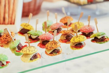 catering buffet with variety of food snacks and appetizers.