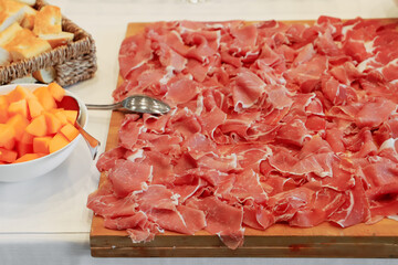 catering buffet with variety of food snacks and appetizers.