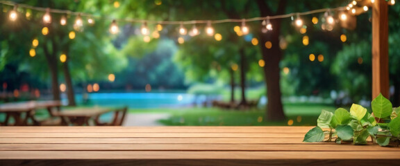 Rustic wooden table in the park with party string lights in the background