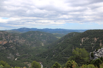 Fototapeta premium Mountains of El Maestrazgo, Castellón, Spain, rugged, rocky, colorful, and with trees